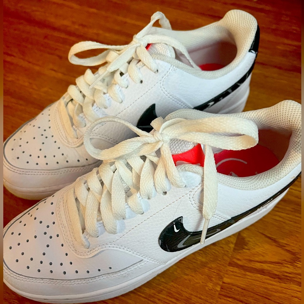 Nike white, pink, and black sneakers